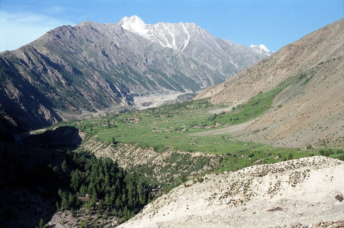 12 View Ahead To Rupal Village And Way Towards Nanga Parbat Rupal Face Base Camp From Tarashing The trek from Tarashing climbs over the Tarashing Glacier with a view of the Rupal Village ahead.